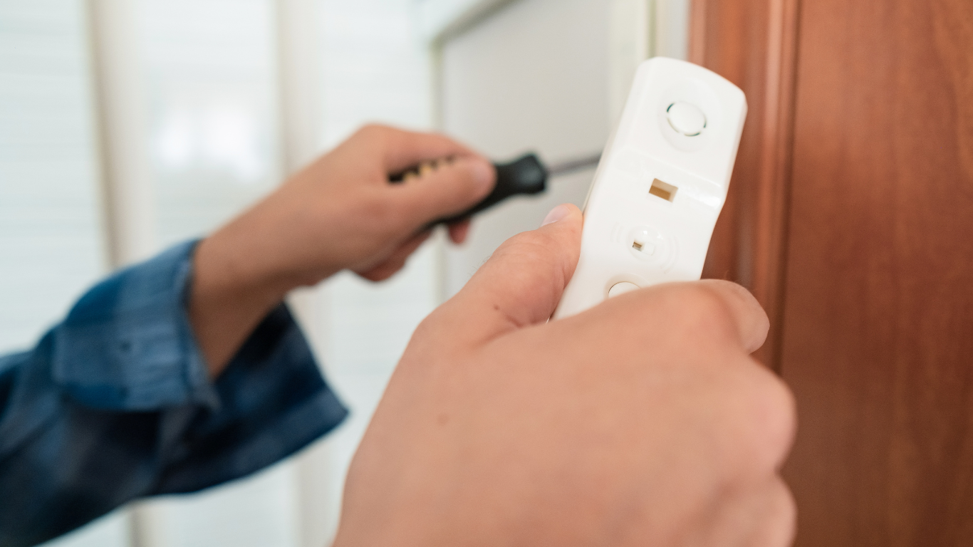 A close up of a keypad on a door.