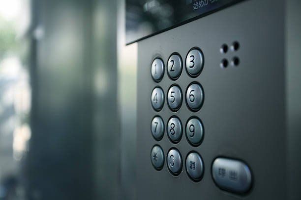 A close up of a keypad on a doorbell.