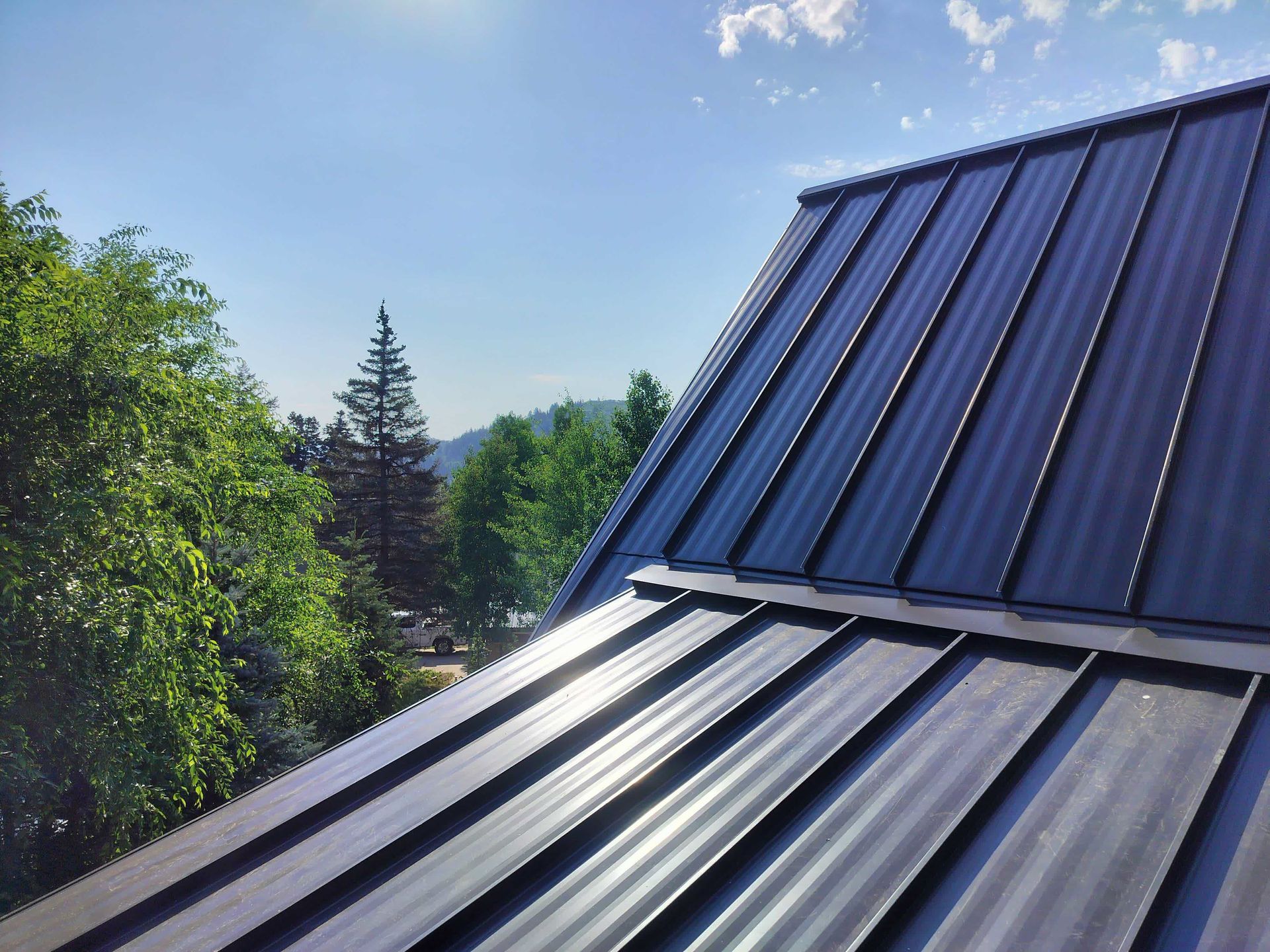 a man wearing a hard hat is working on a roof