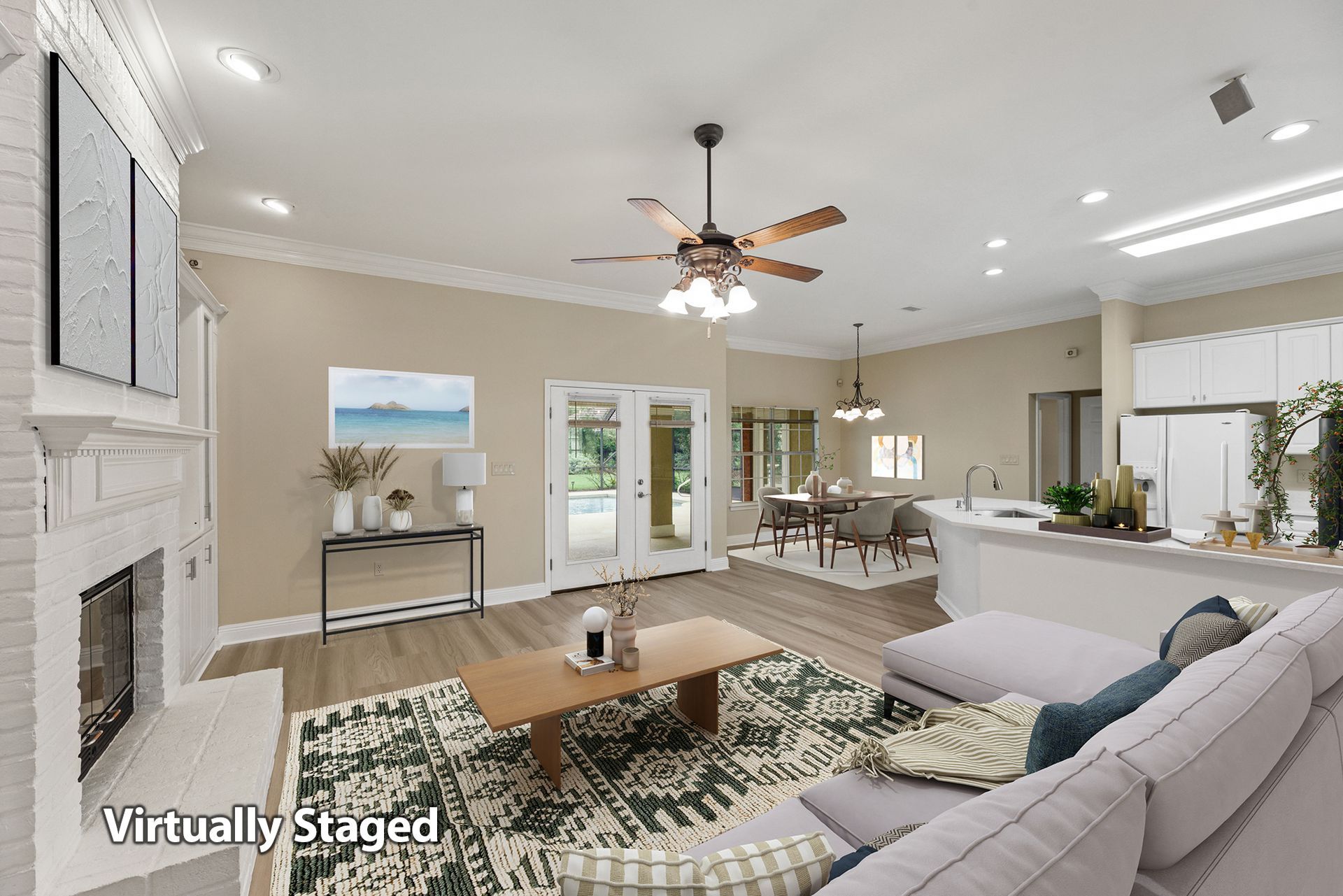 A virtually staged living room with a couch , coffee table , fireplace and ceiling fan.