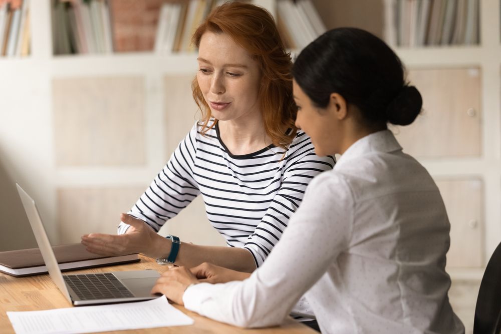 Woman Showing Presentation In Laptop - Rehabilitation in Brisbane, QLD