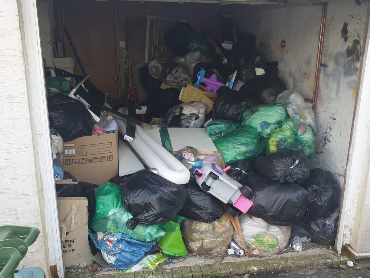 Garage full of rubbish ready to be cleared
