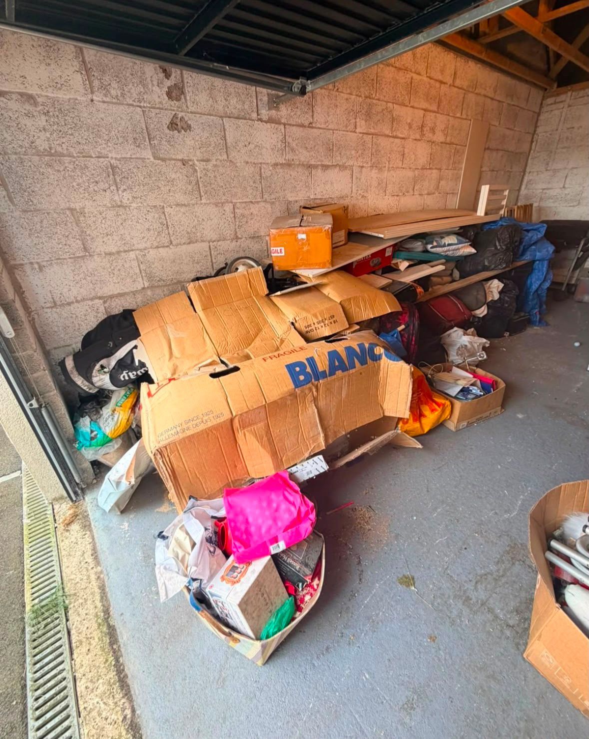 A cluttered garage before clearance by J&Z House Clearance Cardiff