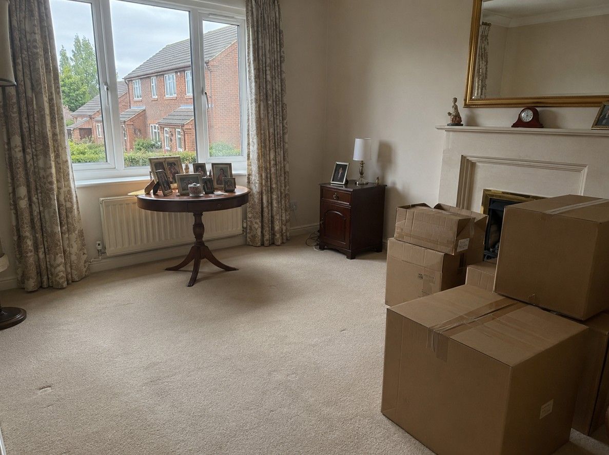 Bereavement house clearance in progress in Cardiff, keepsakes set aside carefully