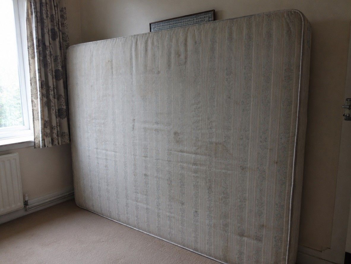 Old mattress propped against a wall ready for collection by J&Z House Clearance Cardiff