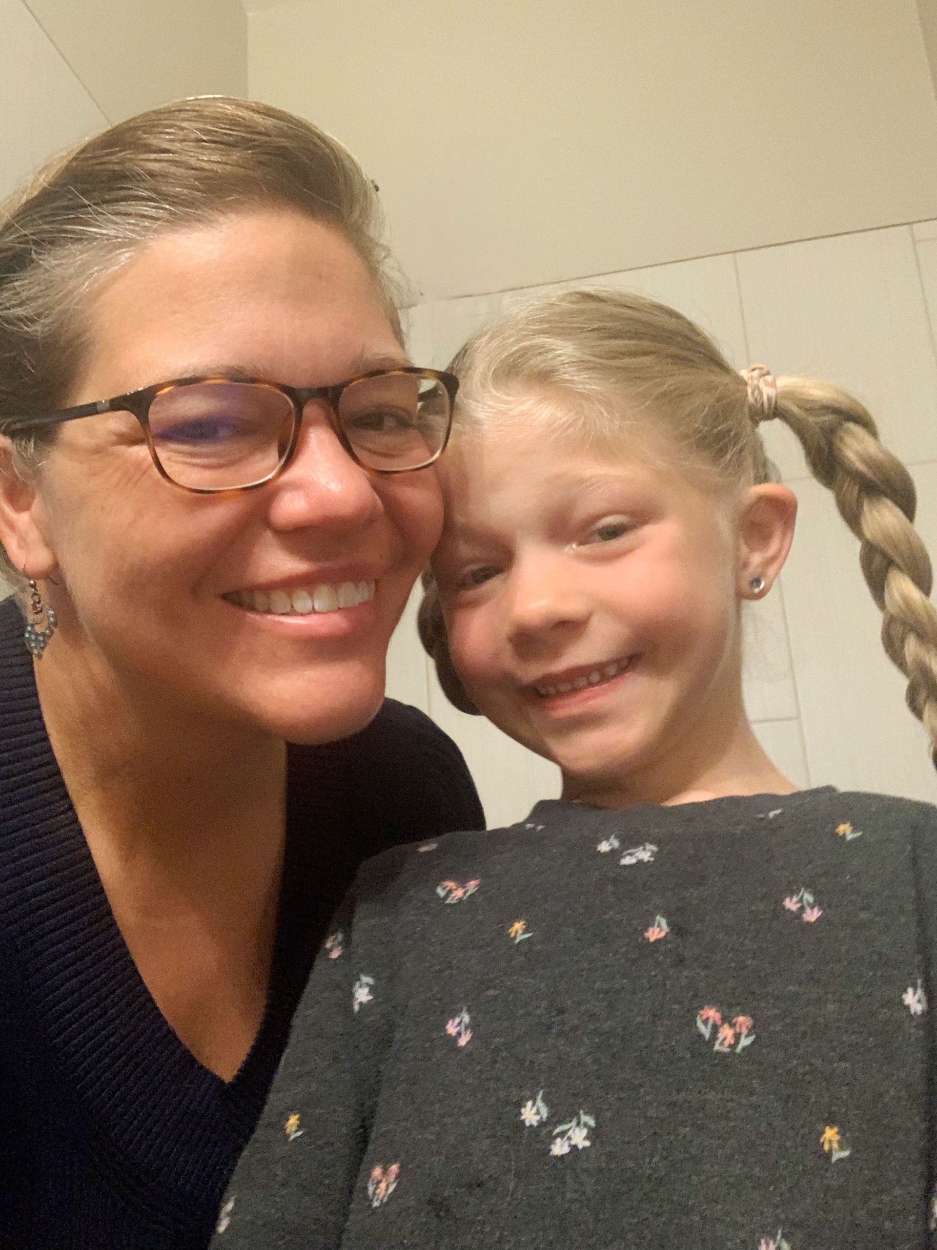 Gretchen Coady holding her little girl in her arms.