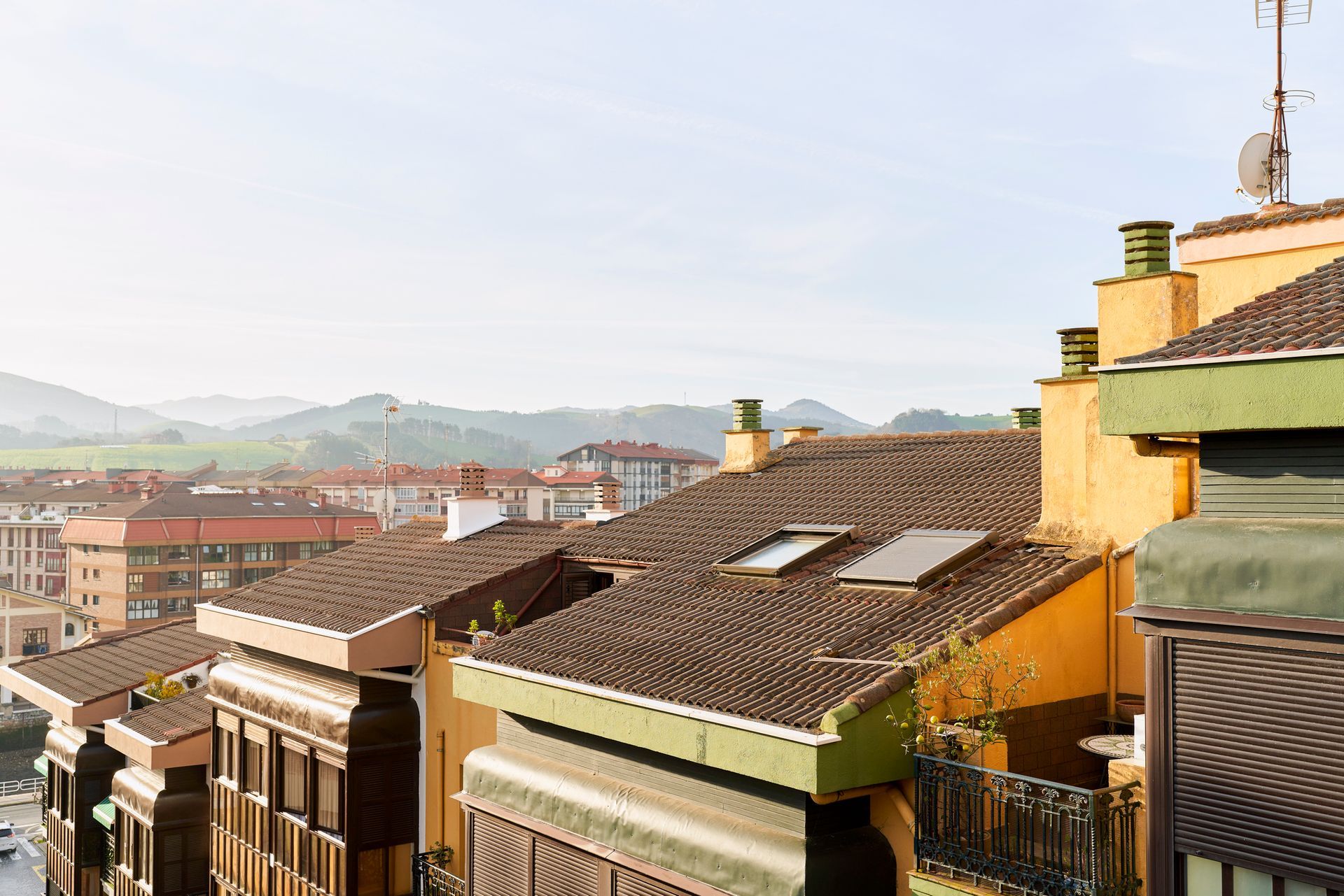 urban buildings with red tiles with skylights and antennas urban buildings with red tiles with skylights and antennas