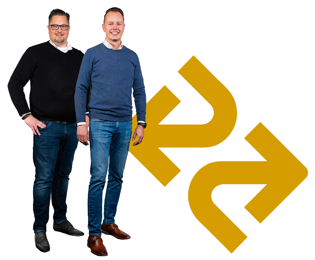 A man and a woman are sitting at a table with a laptop and a tablet.