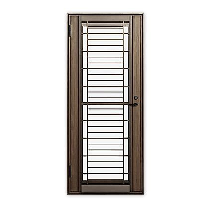 A metal door with a stainless steel grill on a white background.