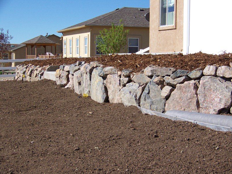 Stone Retaining Walls — Colorado Springs, CO — Green Thumb Commercial Grounds Maintenance Inc.