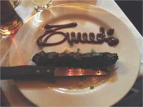 written with cream on plate