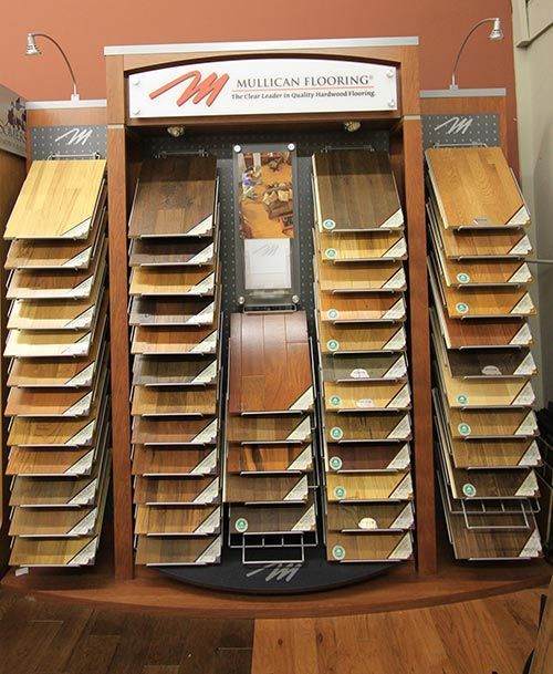 A display of different types of wood flooring in a store