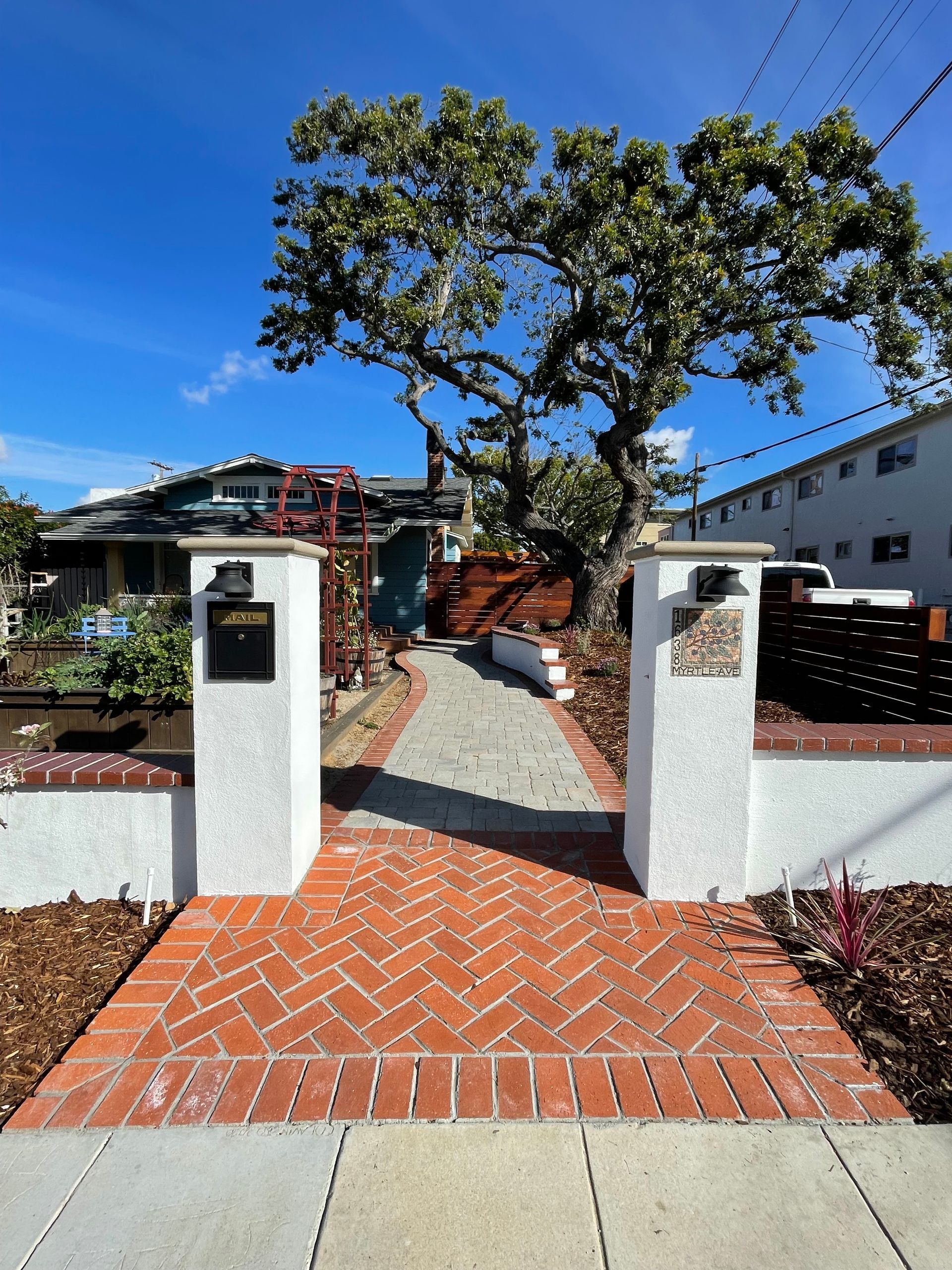 There is a bowl of fruit on the counter in the kitchen. There is a bowl of fruit on the counter in the kitchen.