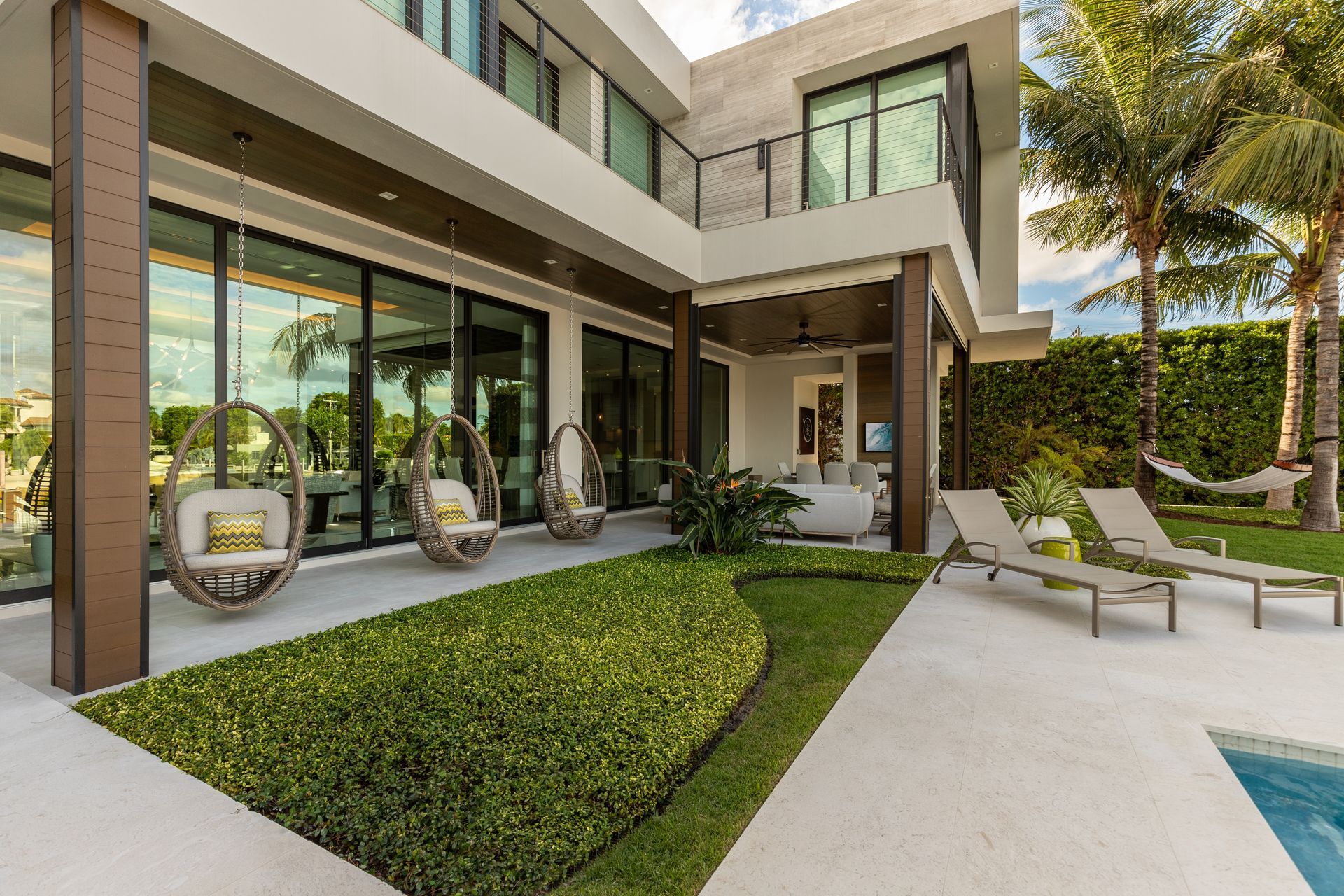 There is a bowl of fruit on the counter in the kitchen.