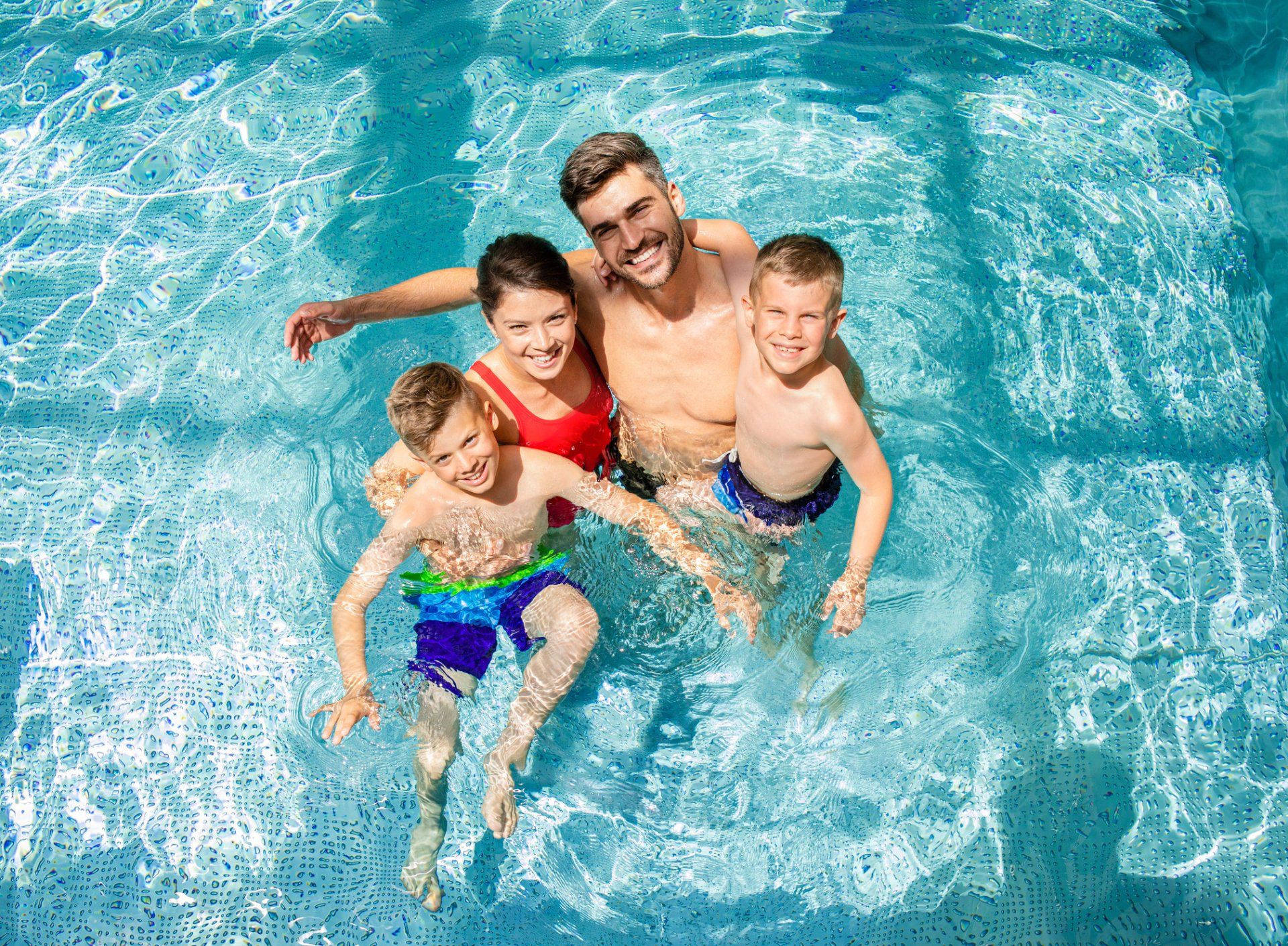 Family Relaxing in  Swimming Pool - Holmdel, NJ - Suburban Services Inc