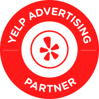 A yelp advertising partner badge with a star in the center