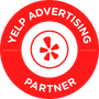 A yelp advertising partner badge with a star in the center