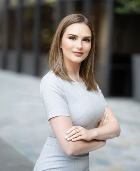 A man in a suit and tie is smiling for the camera.