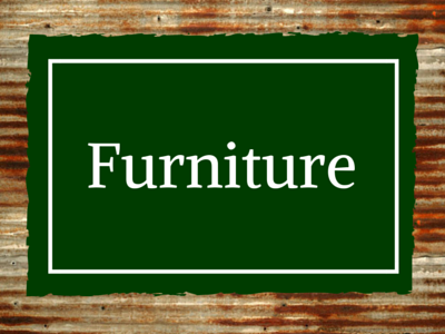 A green sign with a white border and the text 