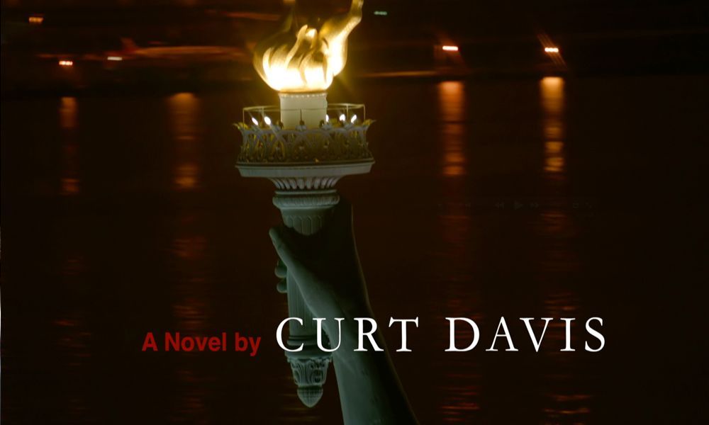 Torch of the Statue of Liberty with flame in a dark setting, author credit: Curt Davis.