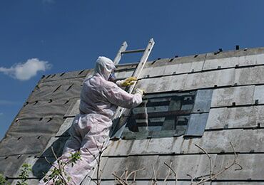 Someone Performing the Process of Asbestos Removal — Roofing in Newcastle, NSW