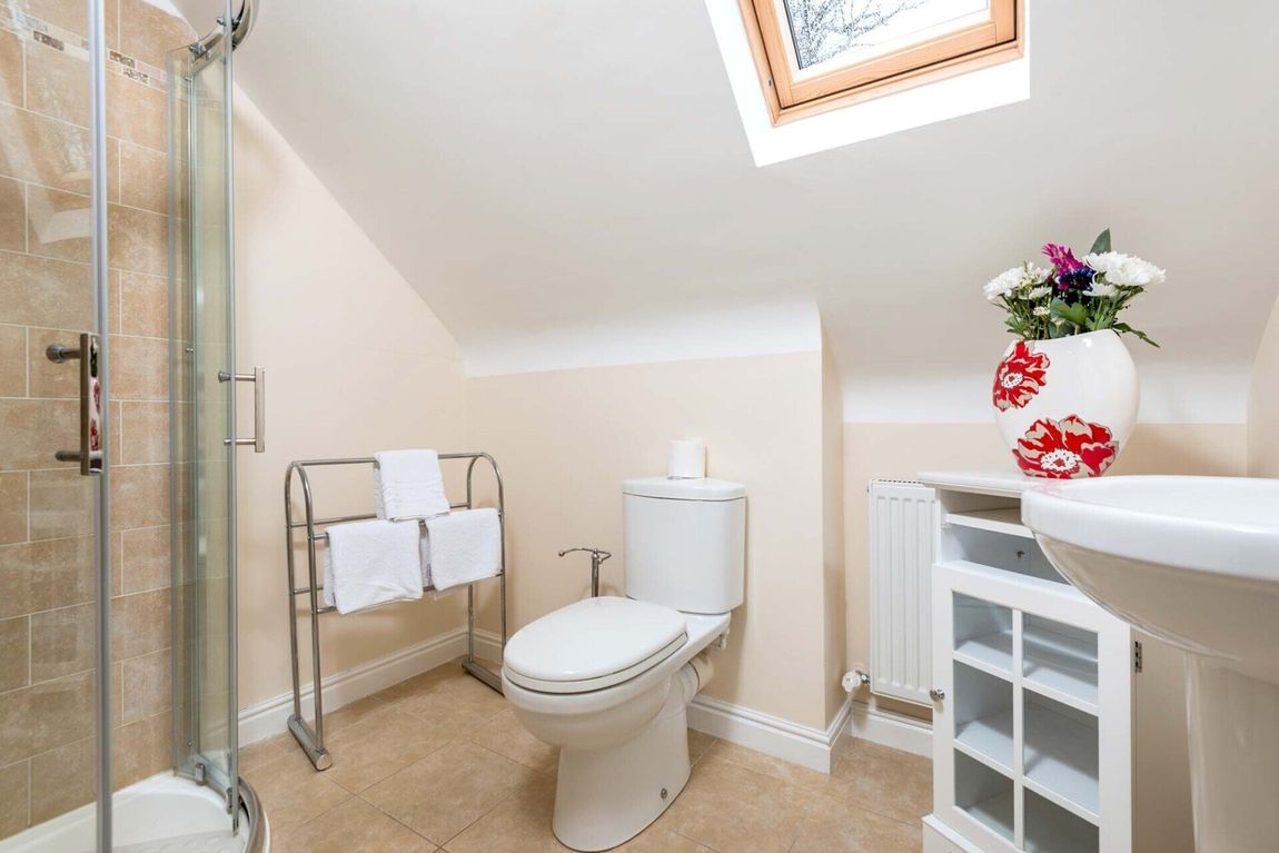 Shower room with pretty red vase