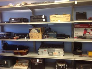 shelves with items at pawn shop