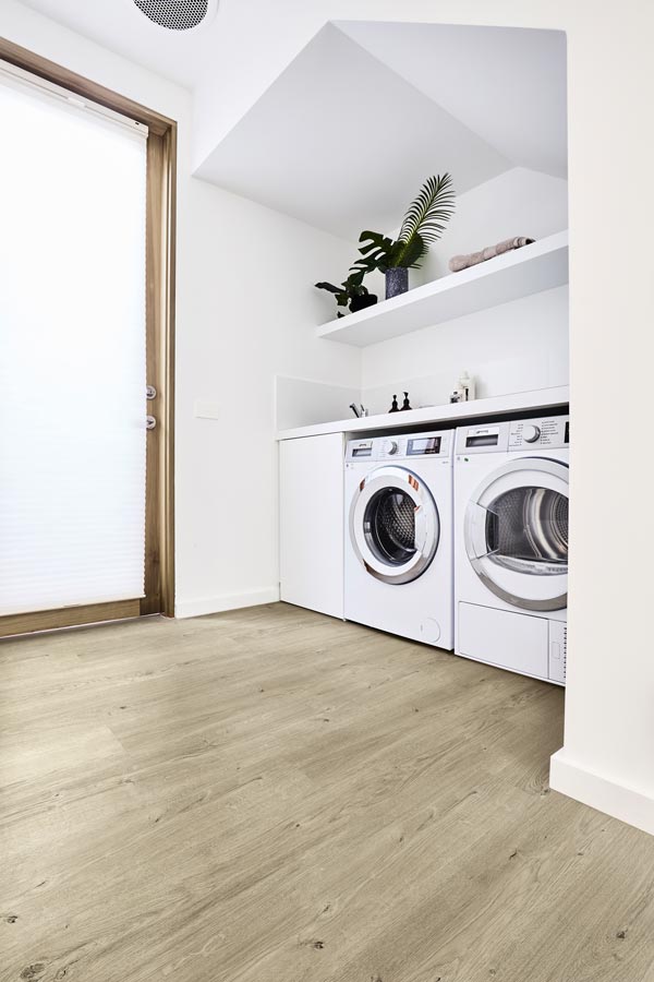 laundry room with vinyl plank floor