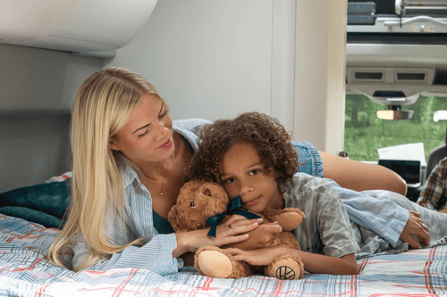 Breeze Campers vw grand california campervan with family lying in rear bed