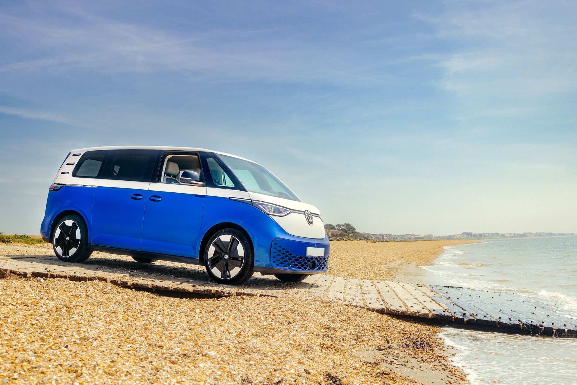 VW id buzz electric van on beachfront in Dorset and Hampshire