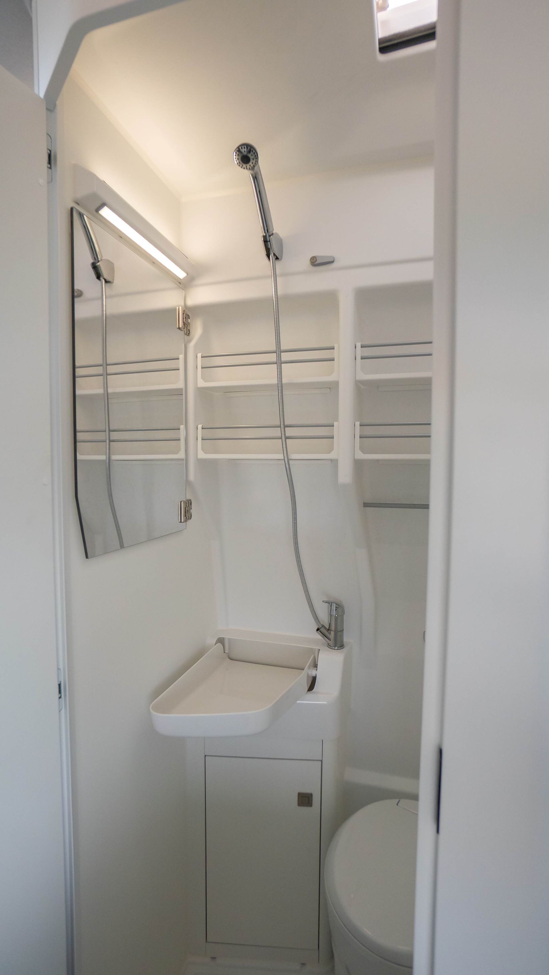 toilet, shower and space-saving sink.