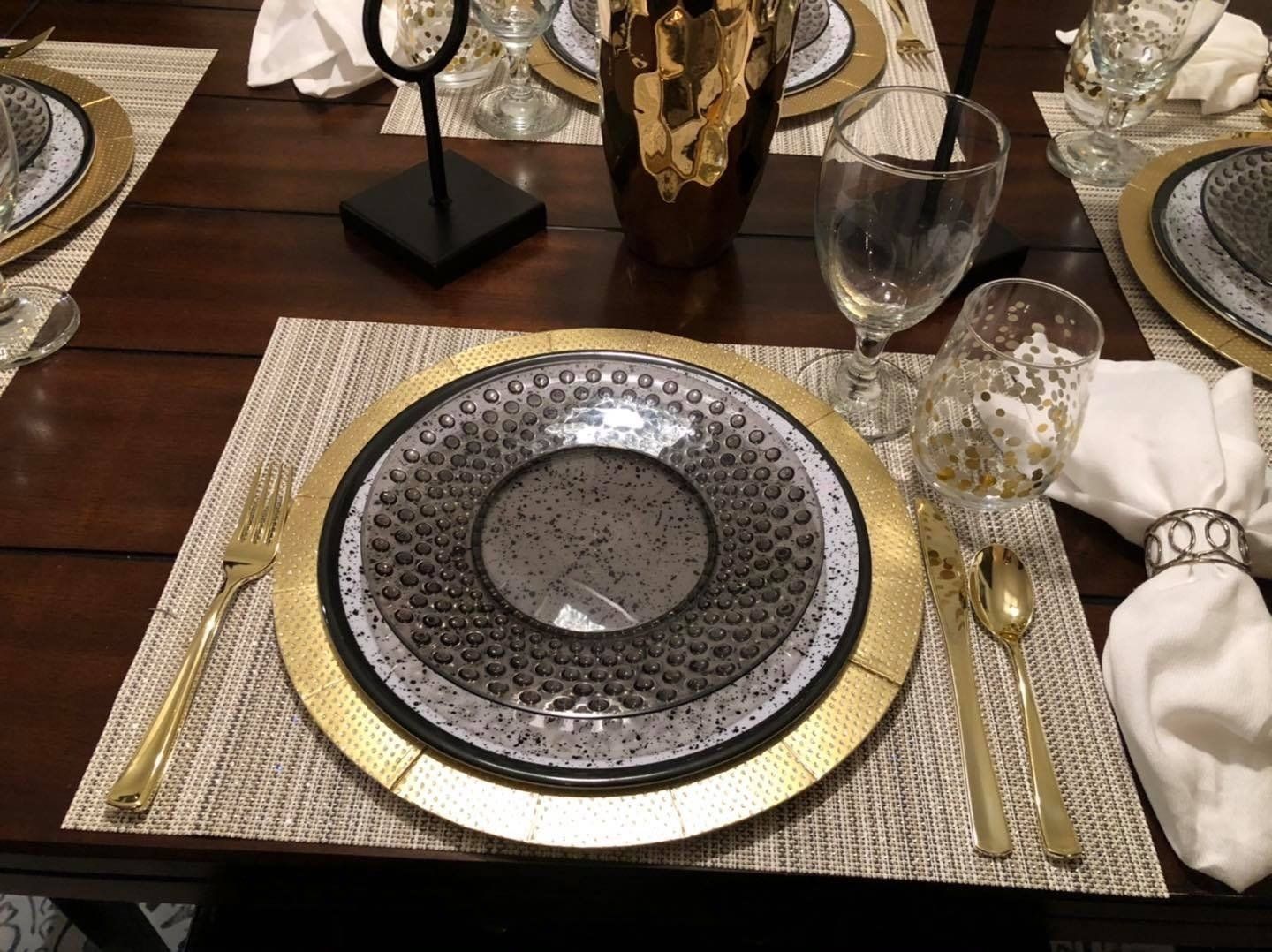 elegant plate and silver on a dinning table, staged for prospective home buyers