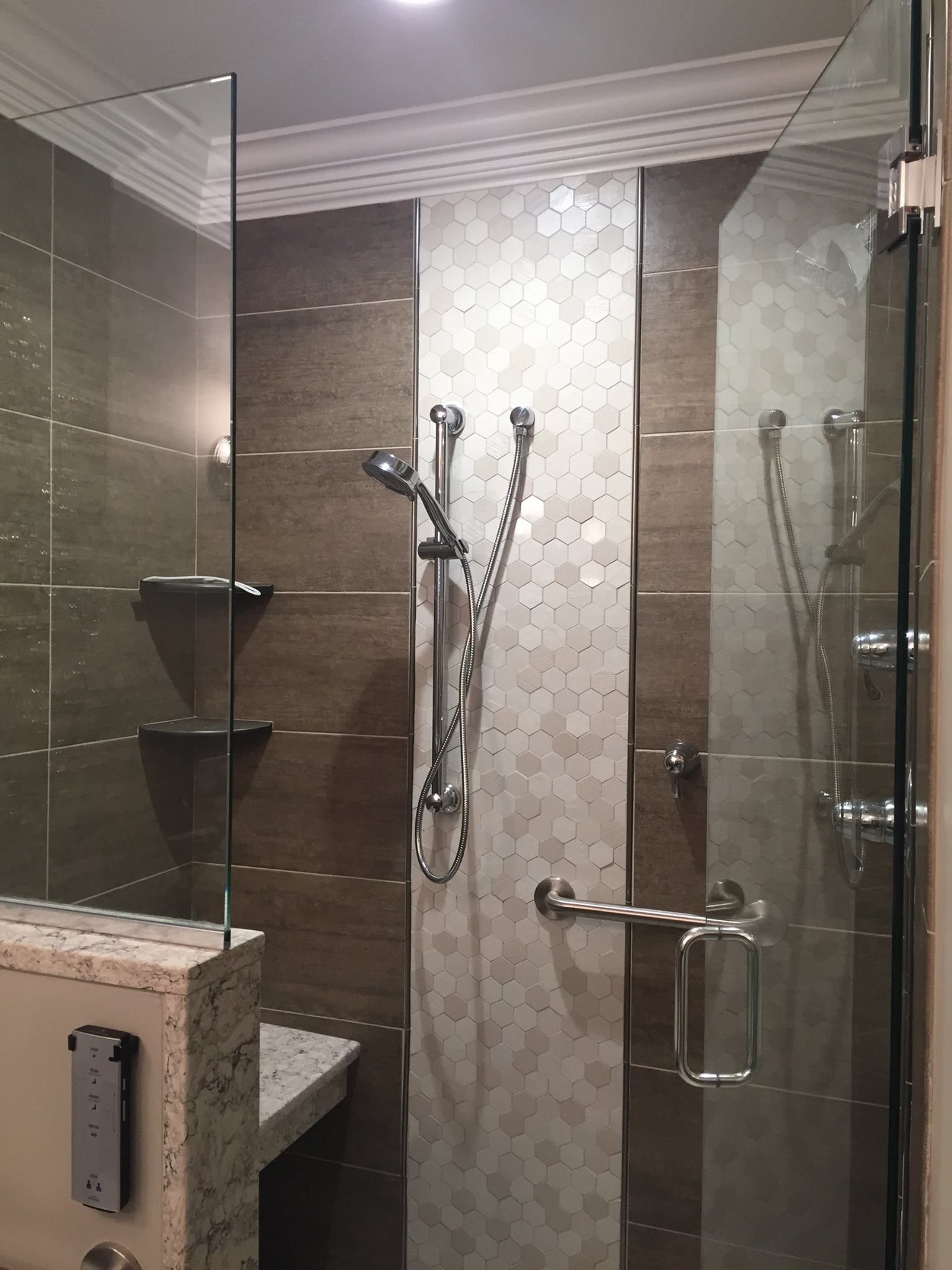 Construction worker kneeling, measuring a wooden board with a tape measure; construction site setting.