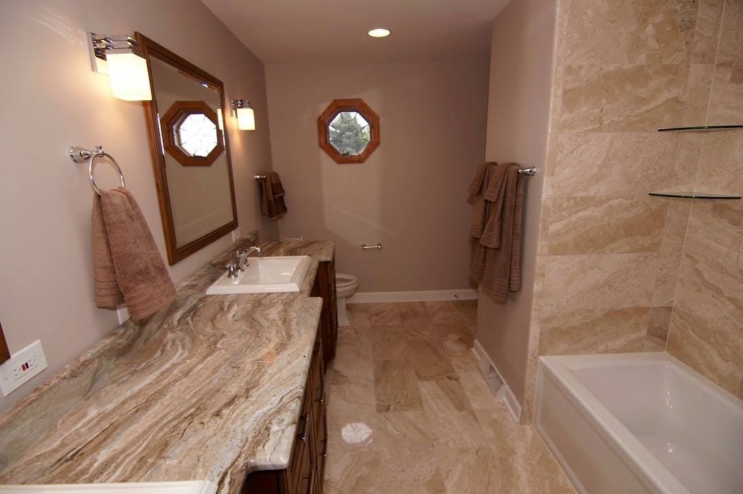 Construction workers in a building under renovation: drilling, carrying wood, measuring, and leveling.