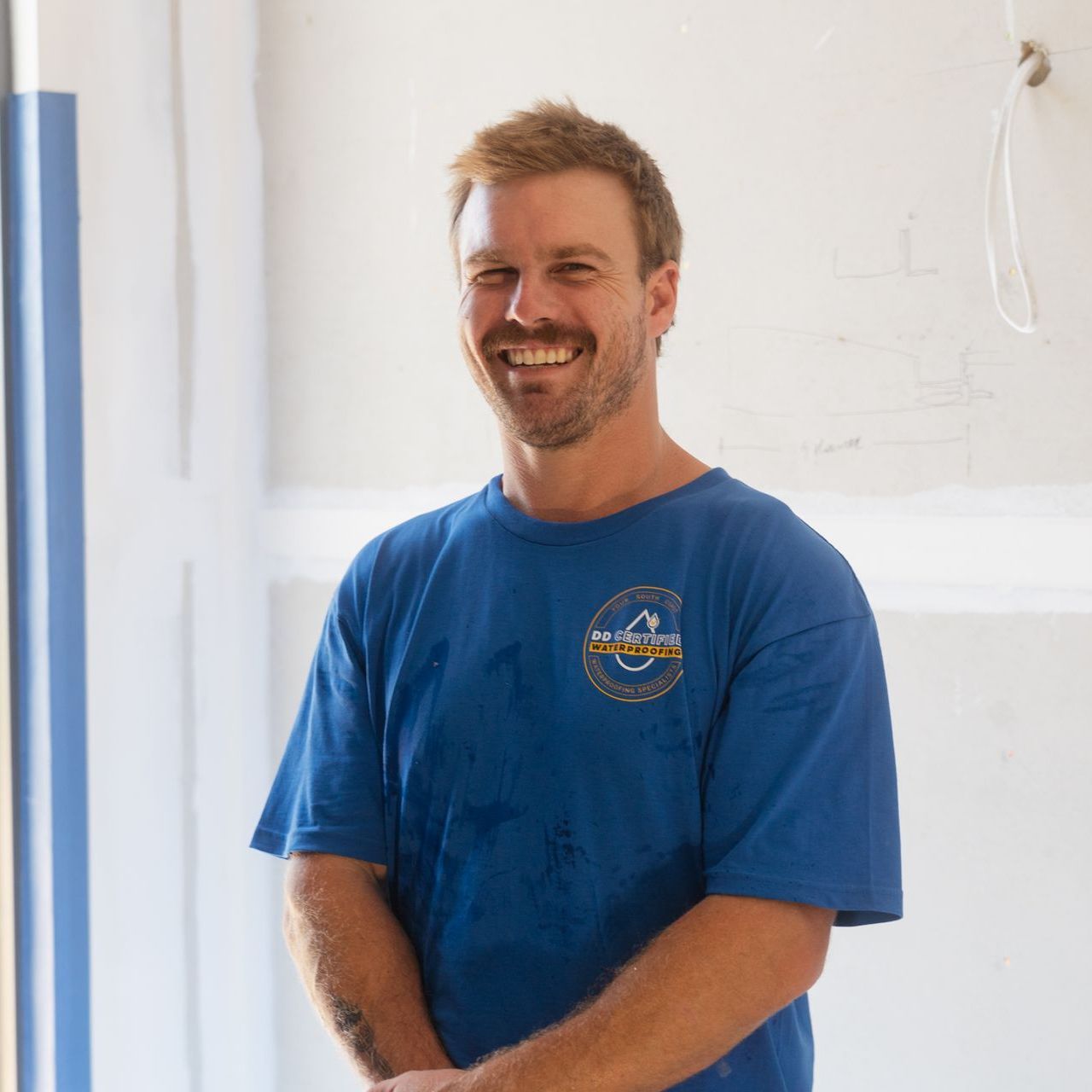 A man wearing a blue shirt with the word masters on it