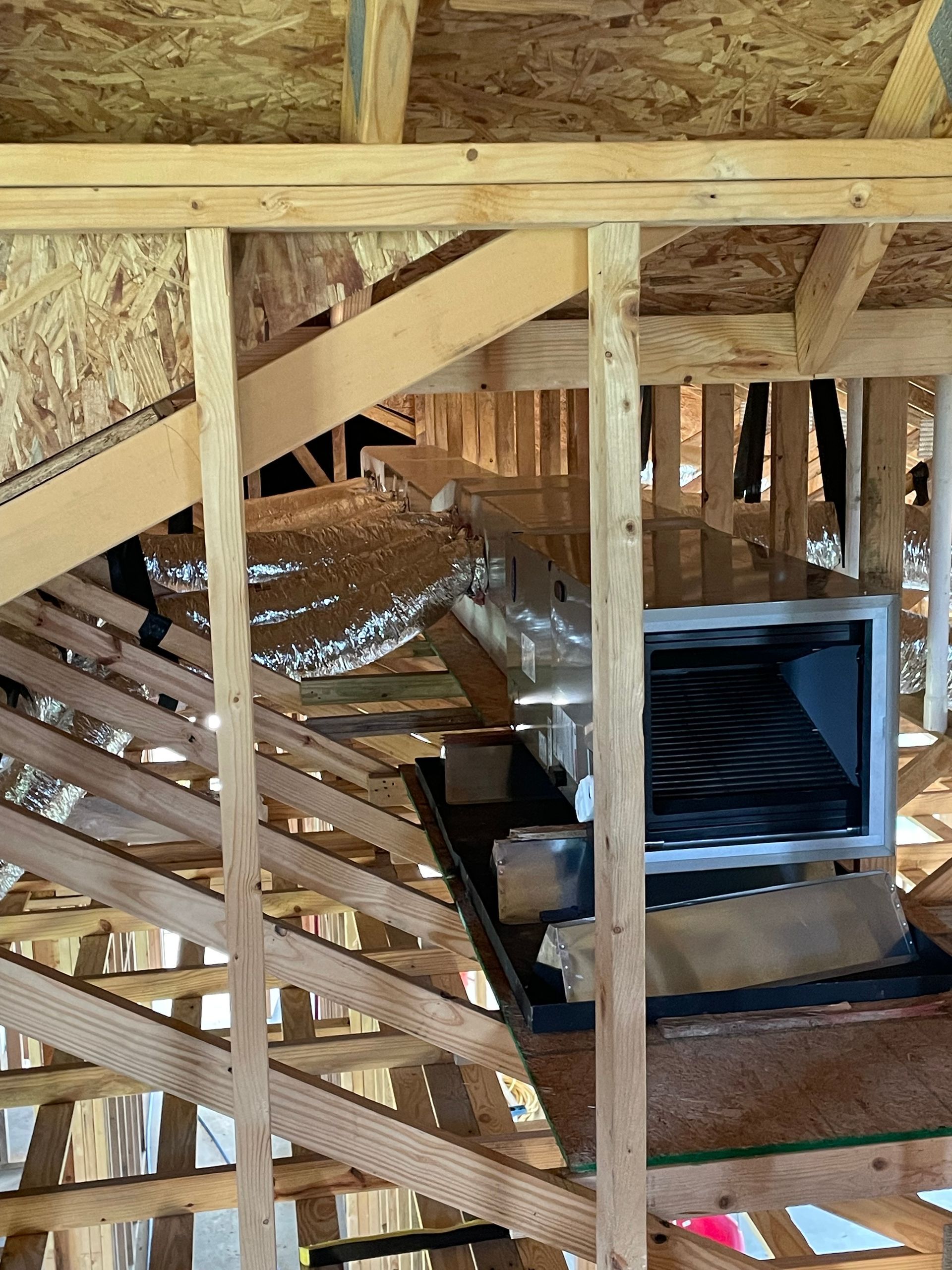 A staircase is being built in a house under construction.