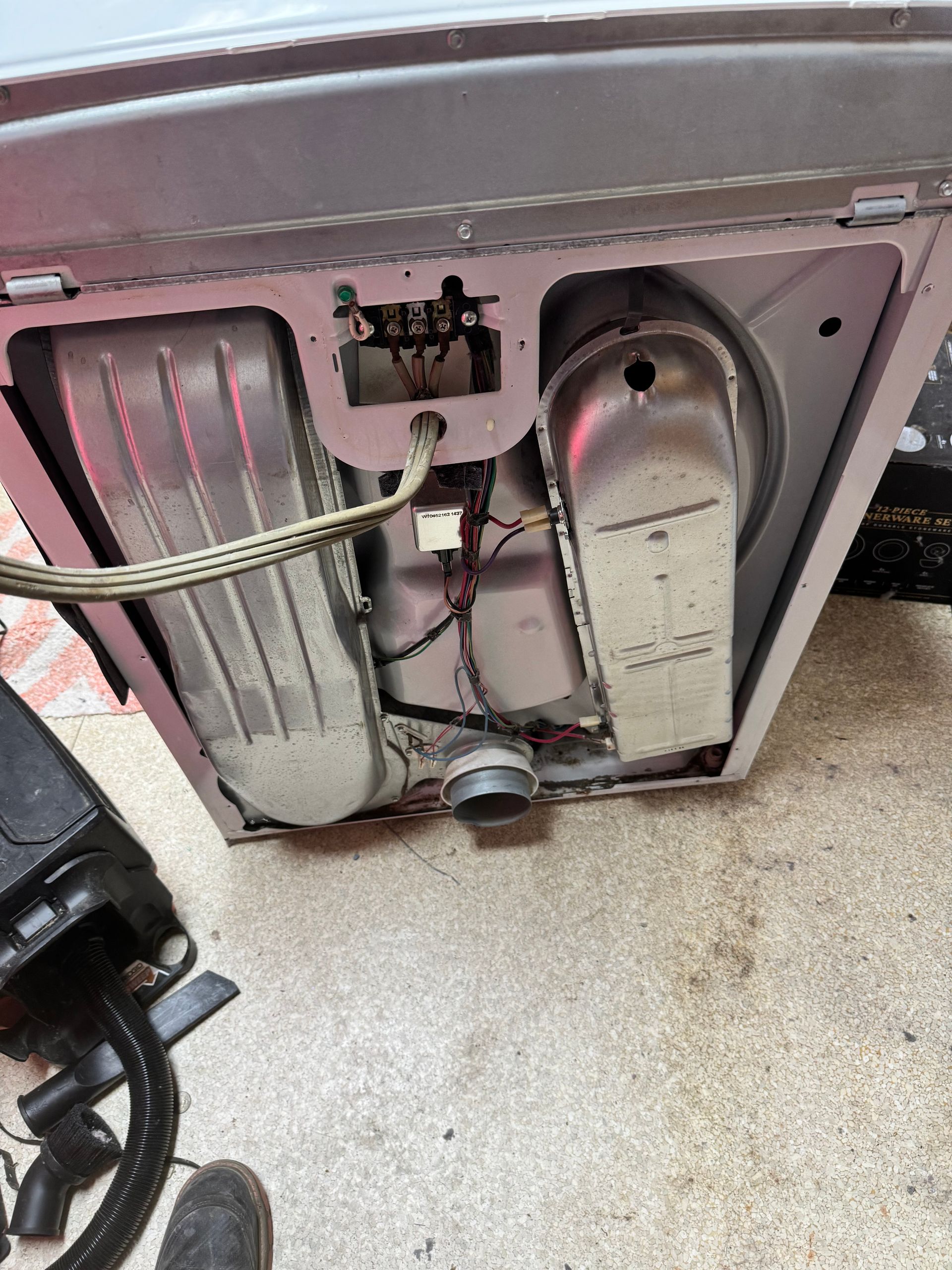 The inside of a washing machine is shown with the door open.