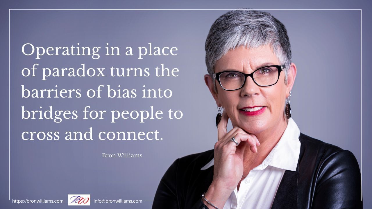 Woman with glasses, quote about bias and connection, gray background.