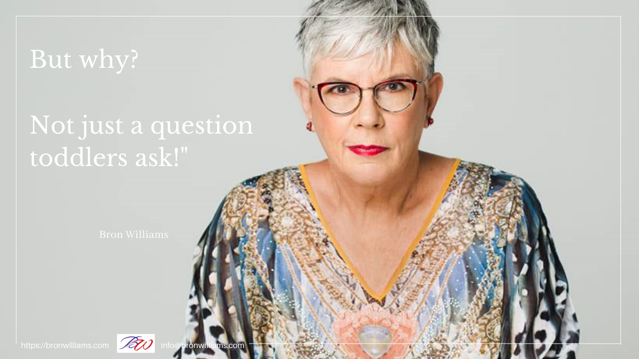 Woman wearing glasses, a patterned top, looking intently at the viewer. Text: 