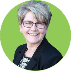 Woman wearing glasses, smiling, set against a green circle.