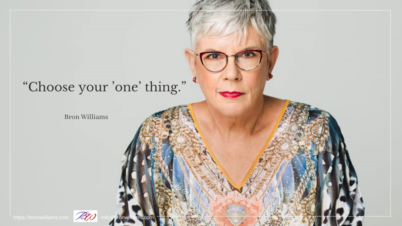 Woman with glasses and a patterned top. Quote: 