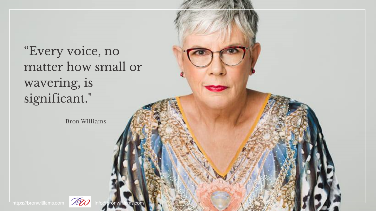 Woman wearing glasses, a patterned top, and red lipstick. Quote: 