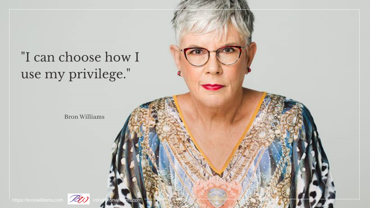 Woman with glasses and colorful shirt, text: 