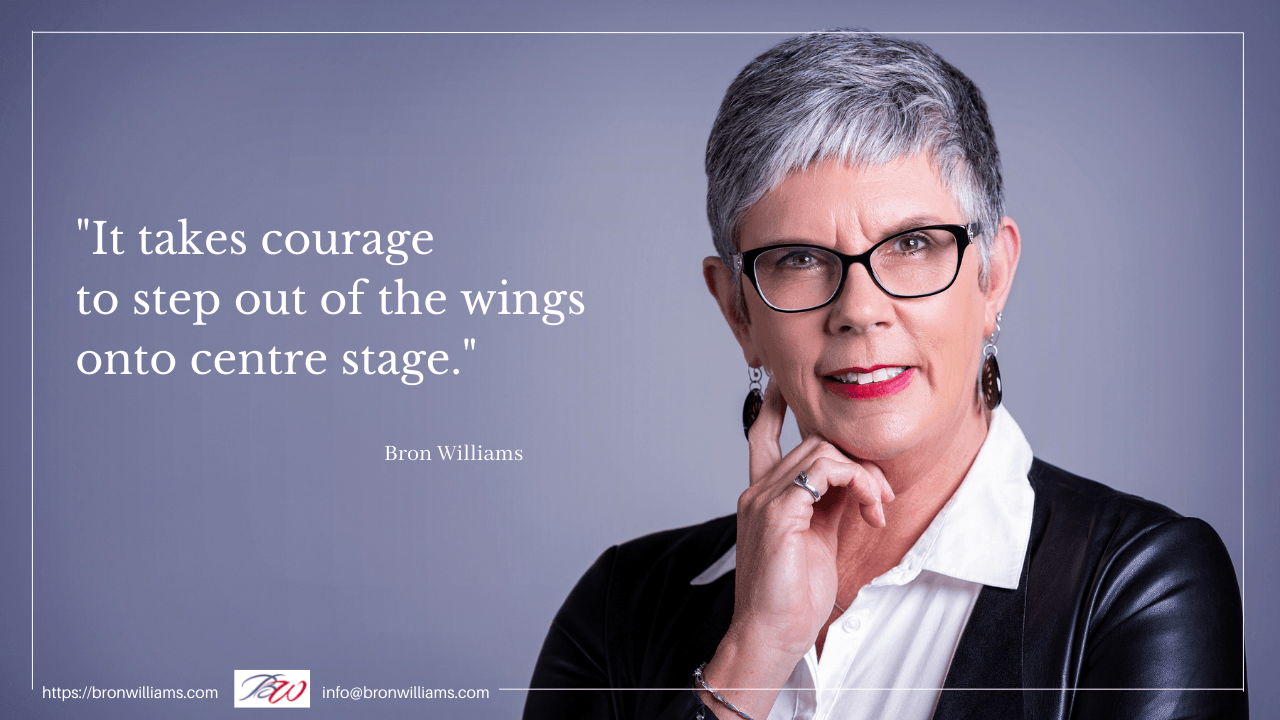 Woman with glasses, hand on chin, smiles; quote 