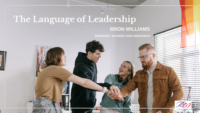 Four people huddling, arms stacked, with text 