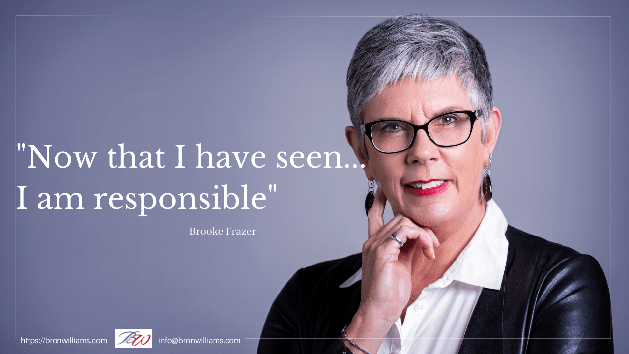 Woman with glasses and black jacket, chin on hand, looking at viewer. Quote reads: 