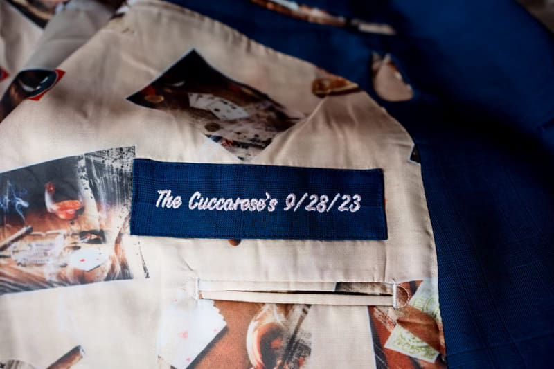 The inside of a blue suit jacket with a blue label that says `` the cuccaros 's 9/28/18 ''.
