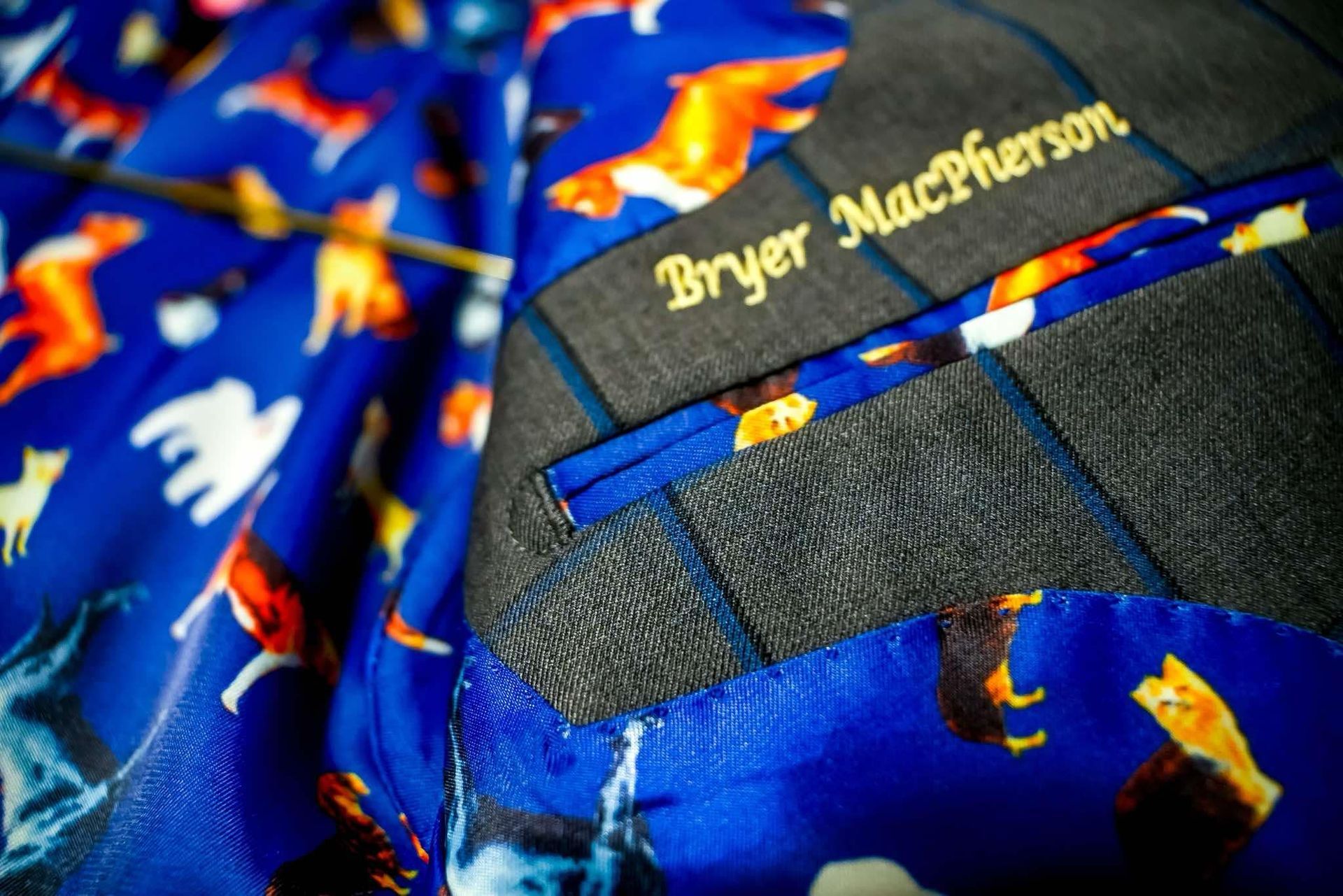 A close up of the inside of a suit by bryer macpherson