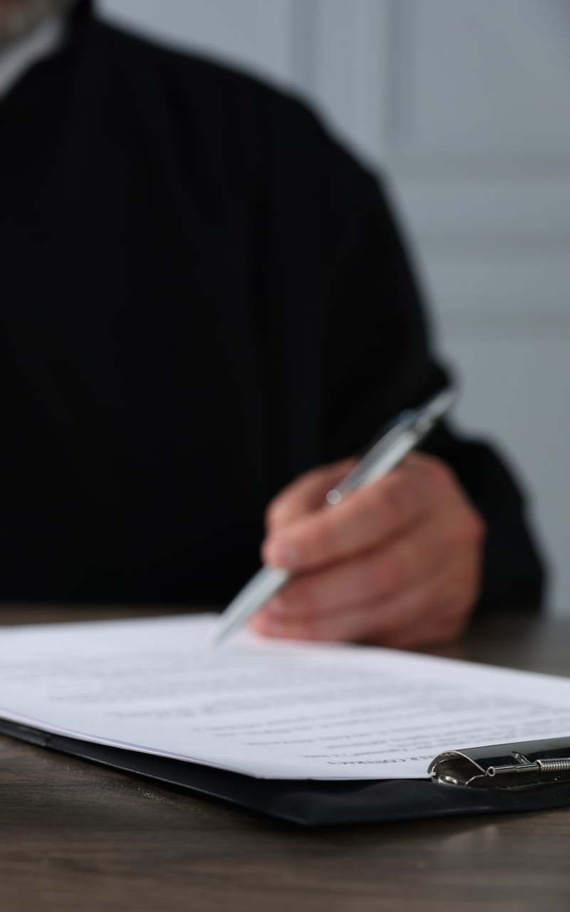 a judge signing a document