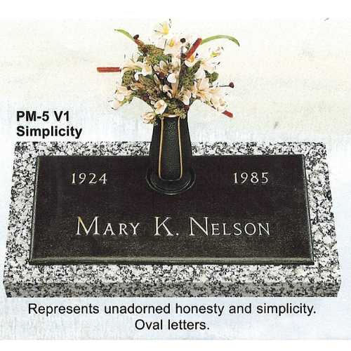 Headstone with a bronze plaque. Dates: 1924-1985. Name: Mary K. Nelson. Flowers in a vase.